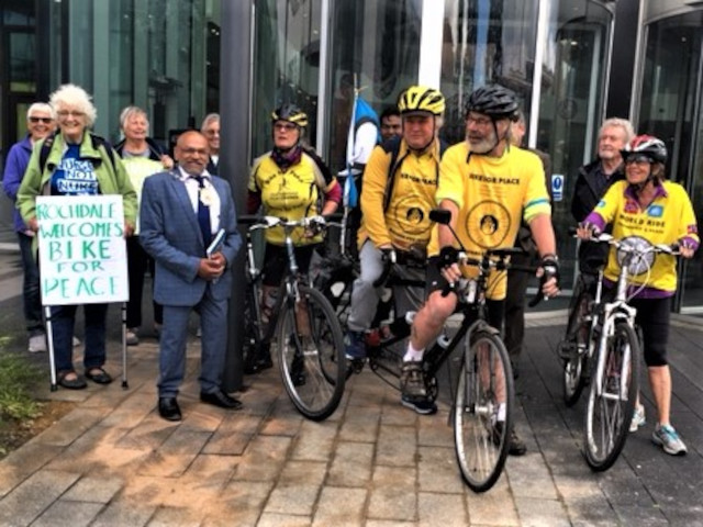 Mayor Ali Ahmed and Consort Sultan Ali with peace activists, waving off the cyclists, Rochdale